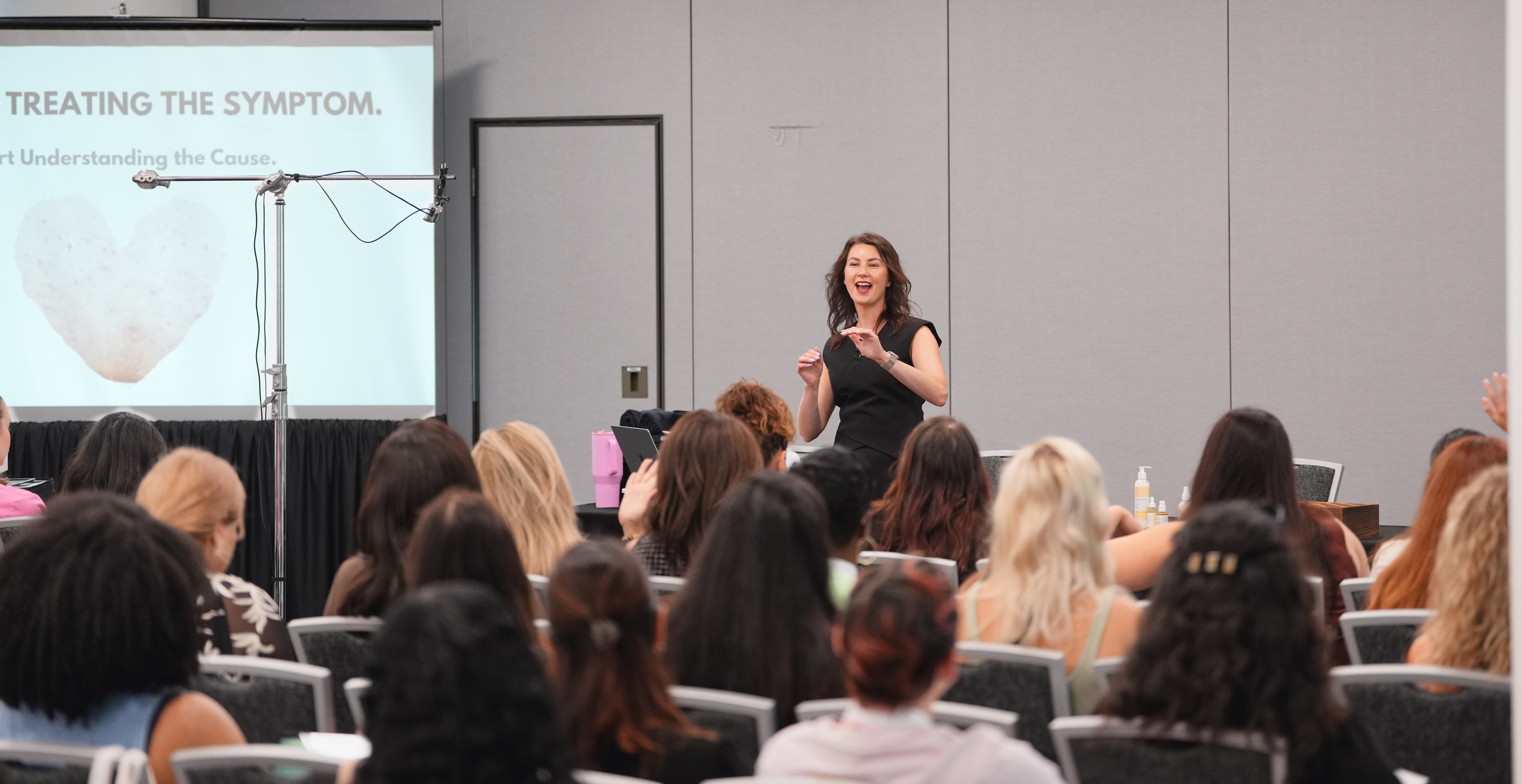 Full room of sugaring professionals attending a Sugar Con 2026 education session